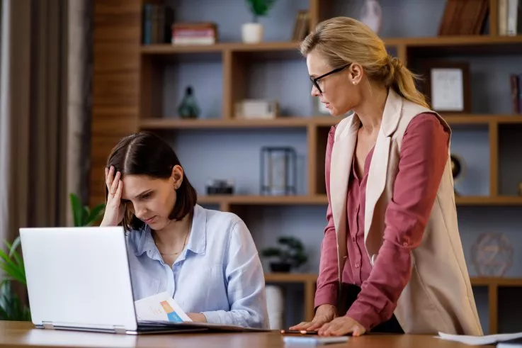 office-people-struggling-over-laptop