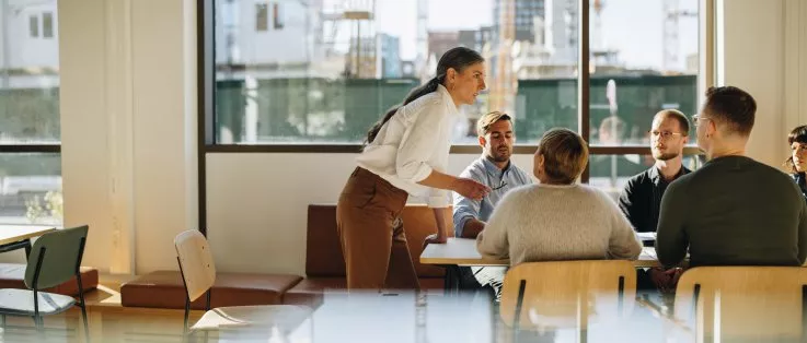 people-discussing-over-table