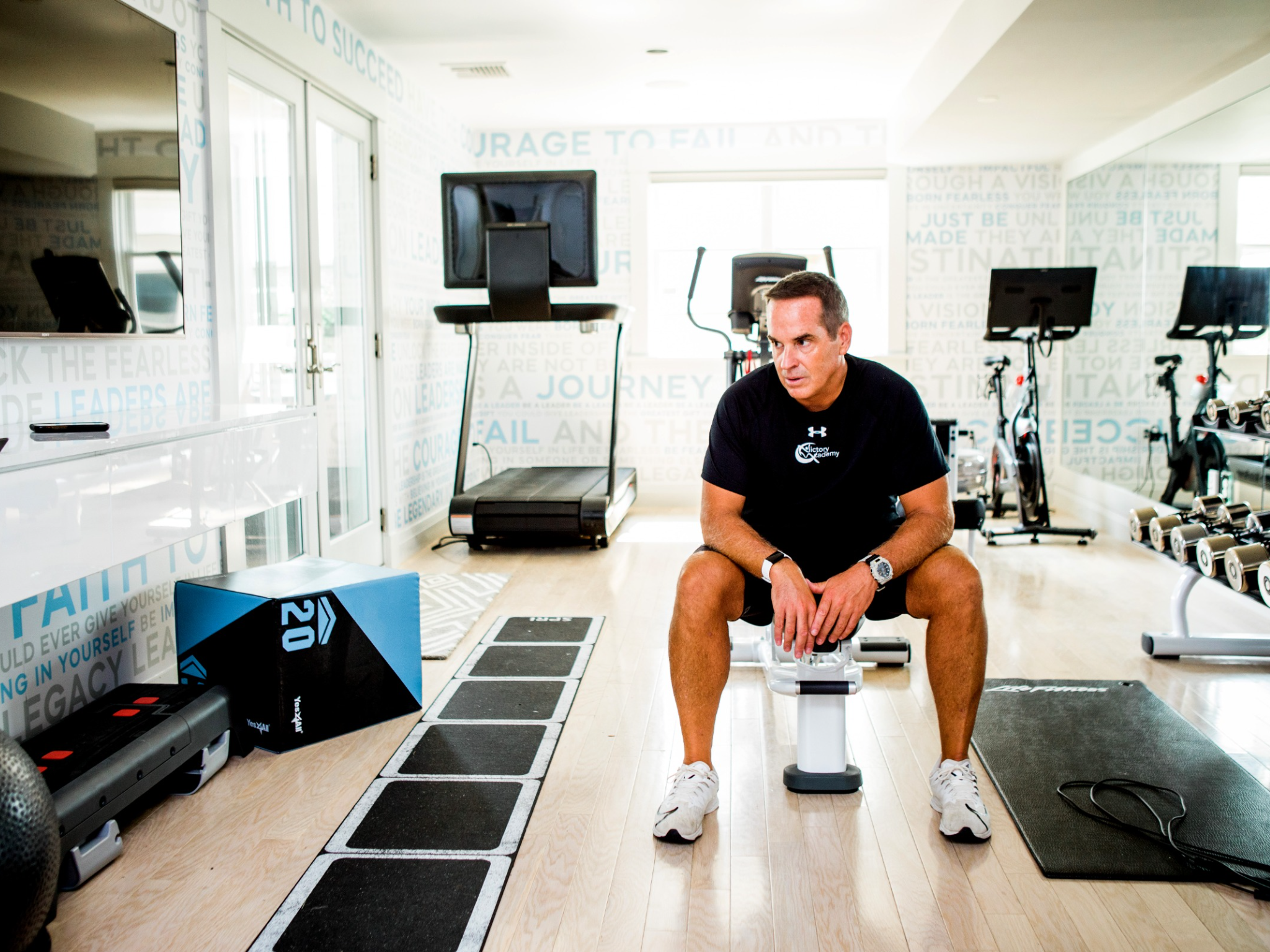 Brendan-sitting-in-gym