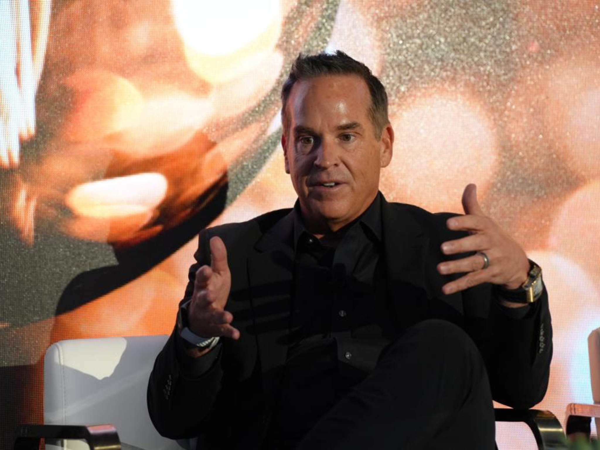 Brendan-sitting-on-stage-talking